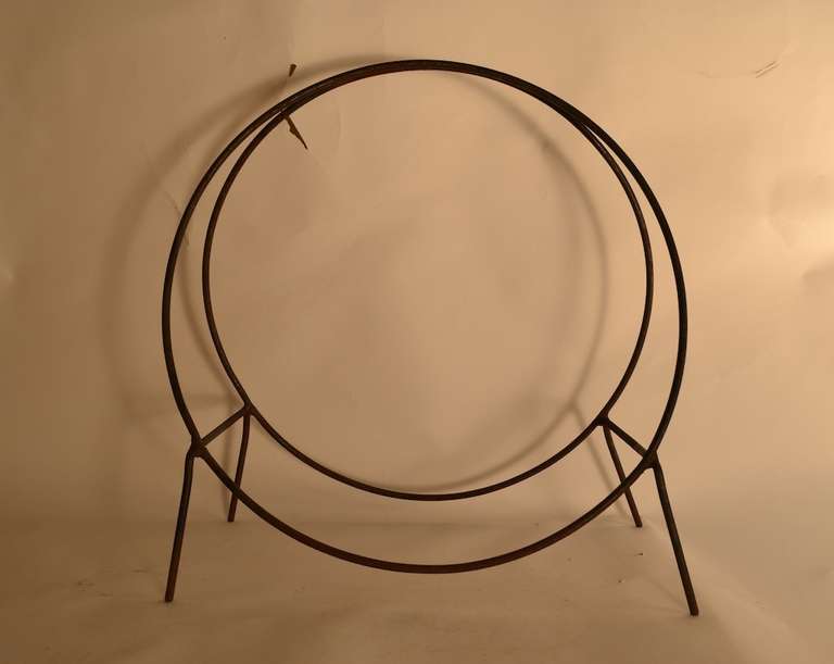 Ideal size for indoor use, for next to the fireplace rather than the larger more common size which is better suited for outside. Solid wrought iron, welded construction, some surface rust and wear, but structurally sound, heavy and sturdy.