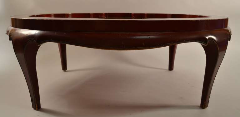 Chinese style Asia Modern mirrored coffee, or cocktail table in the style of  Samuel Marx, Haines, Robbsjohn et al. Chinese Red finish, with inset mirror surface. This example shows some wear to the finish, surface scratches and nick and chips to