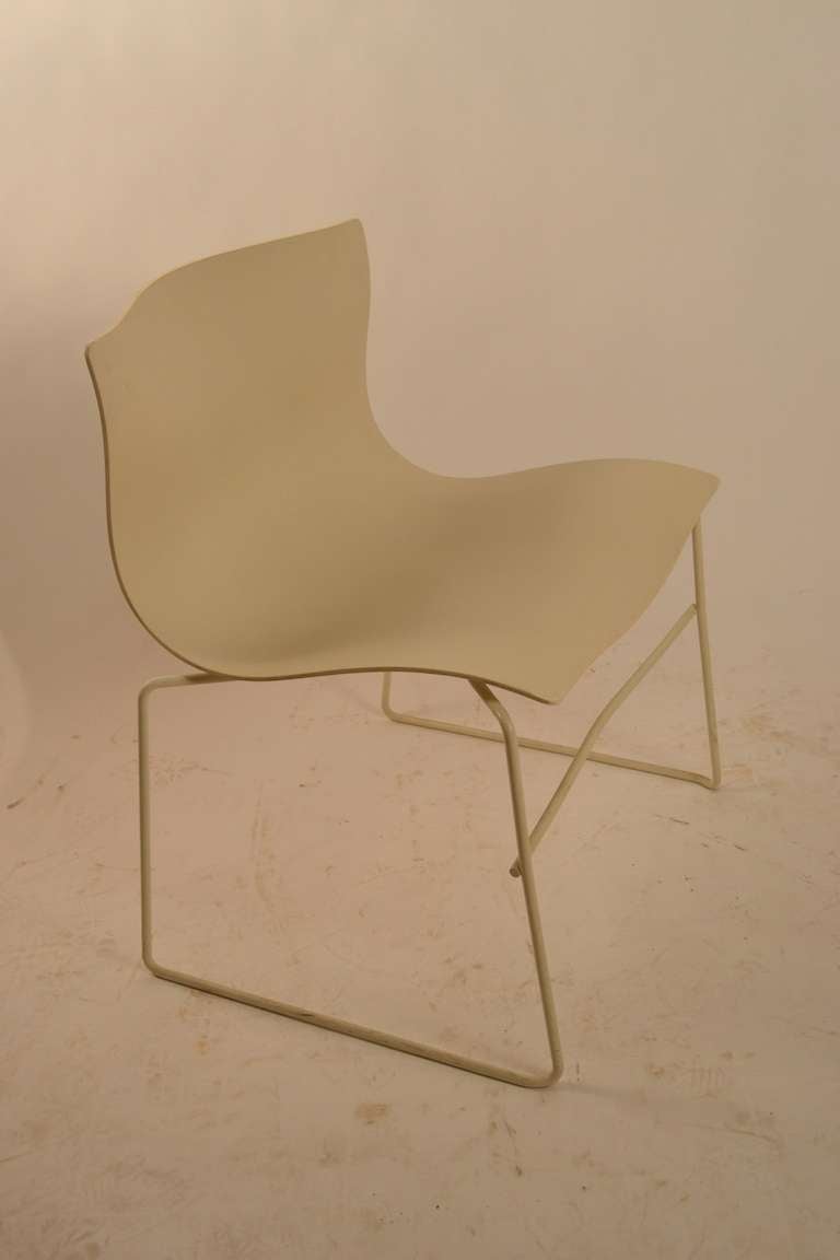 Nice set of four Knoll Handkerchief Chairs, designed by Massimo and Lella Vignelli. These chairs are in white, with white metal bases. All are fully marked and in fine original condition. These chairs stack for easy storage, and are very comfortable