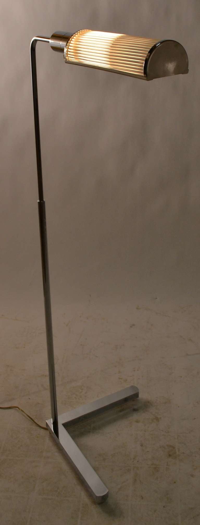 Adjustable Casella floor lamp, with glass rod shade. The hood shade swivels, and the vertical shaft extends ( 38