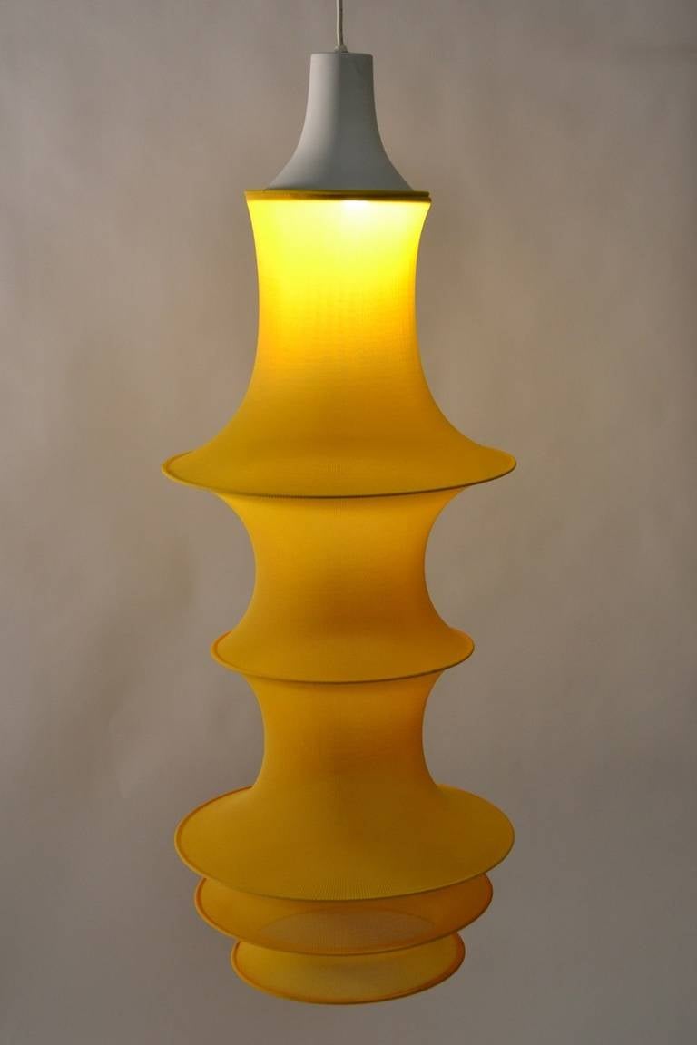 Yellow stretched Lycra Mesh over metal rings. Clean original condition, interesting bright color. Italian, Post-Modern lighting design classic. Height in listing does not include cord.