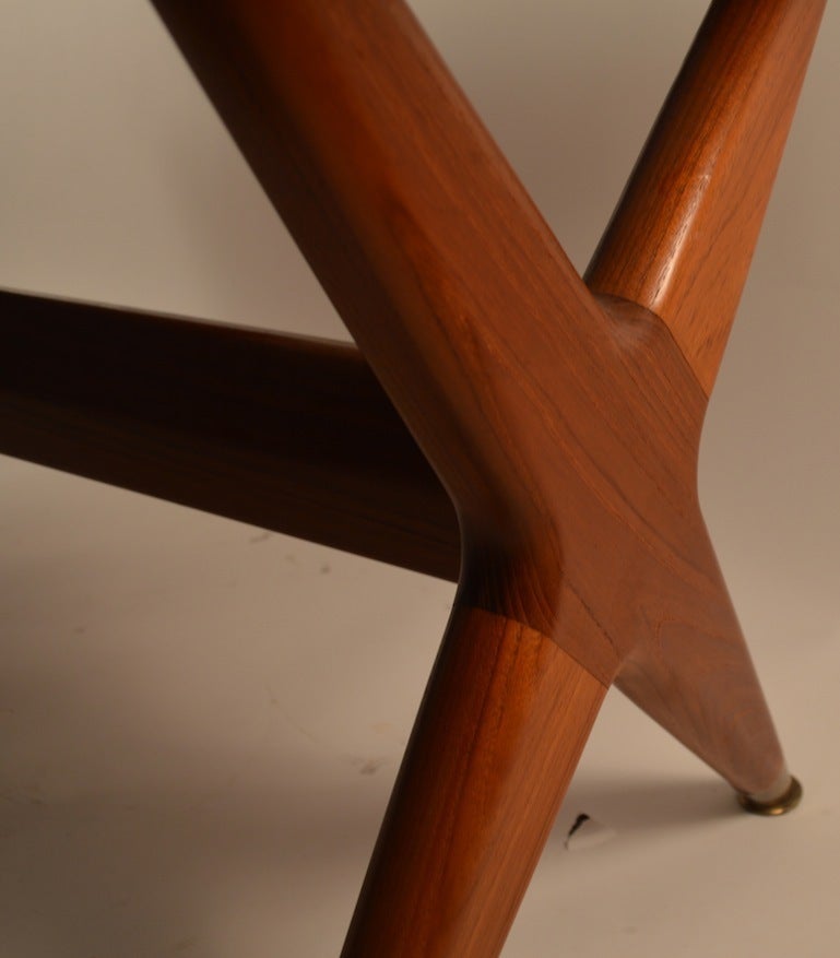 Teak Danish Modern style dining table designed by Fredrik Kayser for Gustav Bahus of Norway. This example comes with two 13.75
