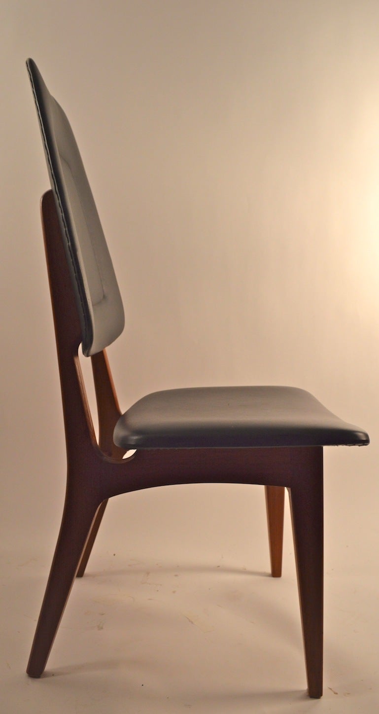 Pair of teak side chairs marked 