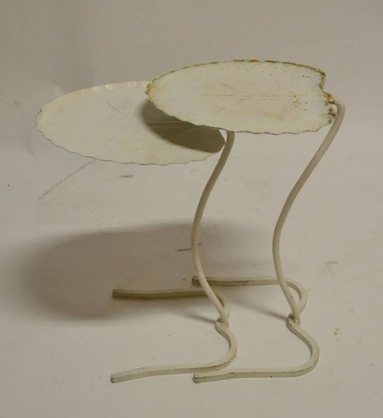 Two nesting metal Lily Pad tables, in white paint. The shorter (18