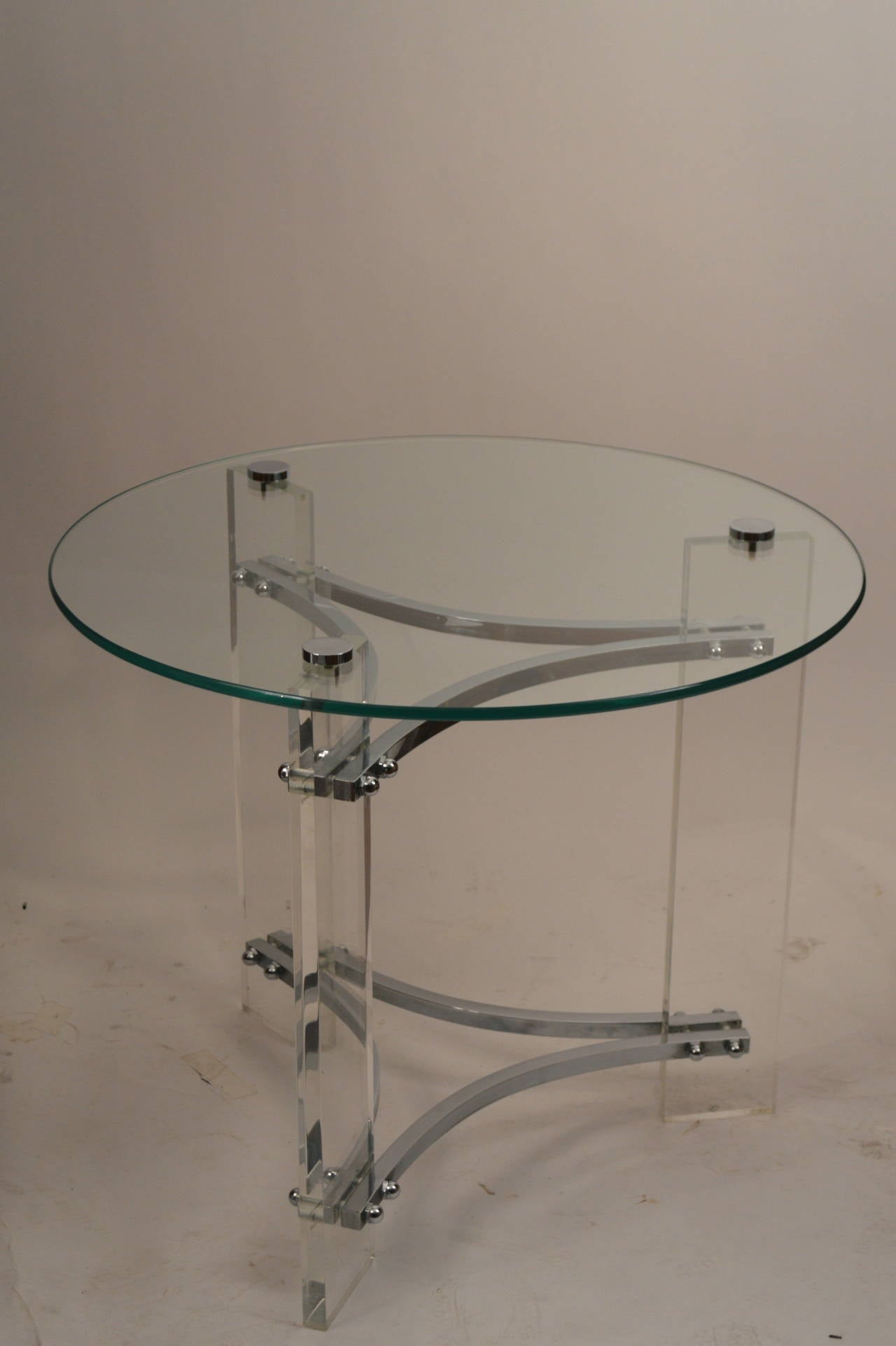 Nice matched pair of lamp, end, occasional tables. Solid lucite legs with bright chrome stretchers, thick (.25