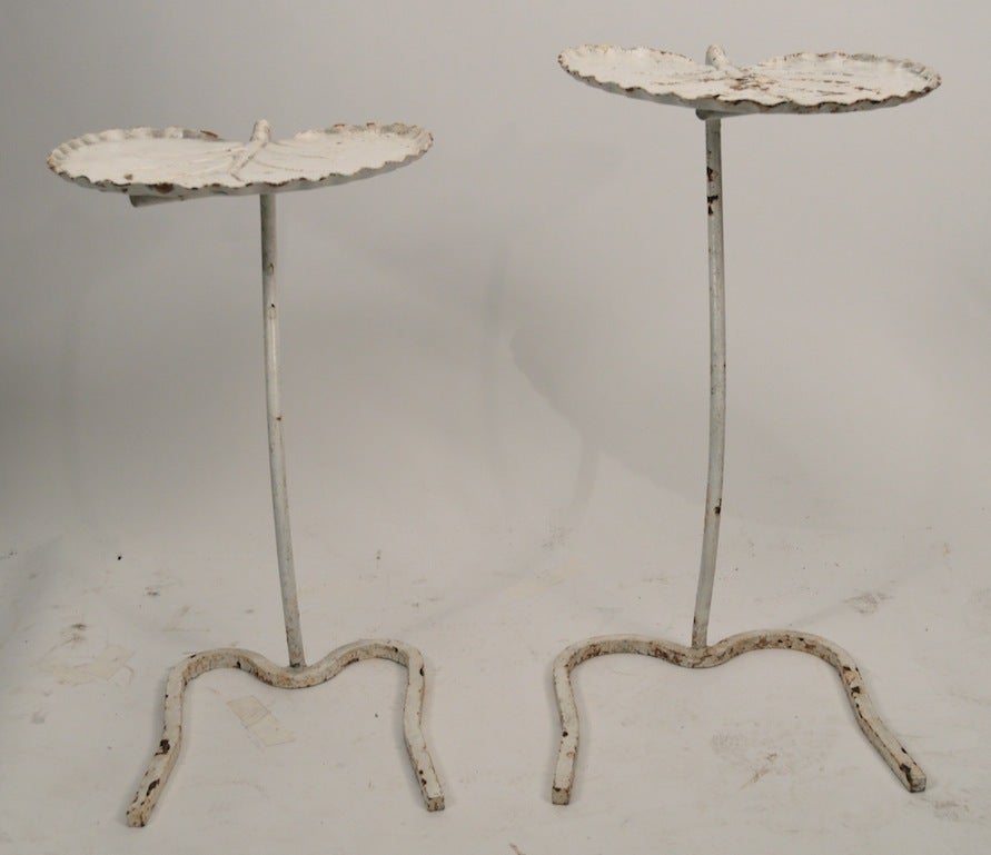 Two Salterini nesting leaf tables, in old white paint finish. Paint finish shows wear consistent with age, and outdoor use. 
Dimensions in listing are for the larger table. Tables suitable for indoor or outdoor use.