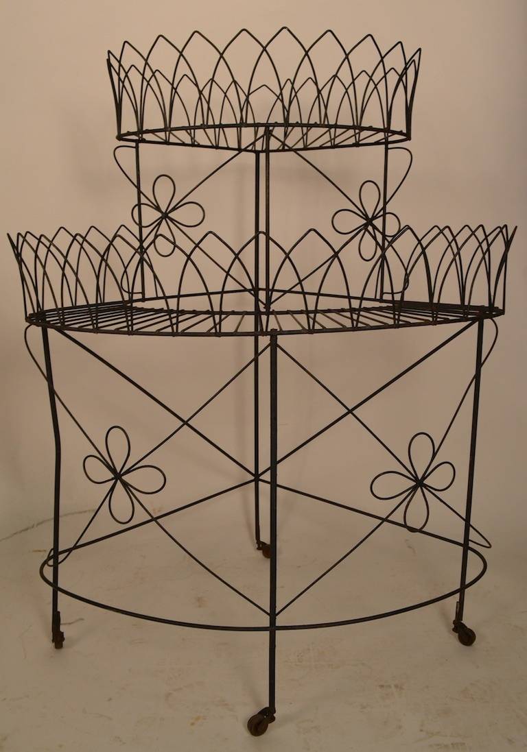 Unusual wire plant stand designed by Frederick Weinberg. Great for indoor or outdoor use, for plants, or can be repurposed to suite your needs.