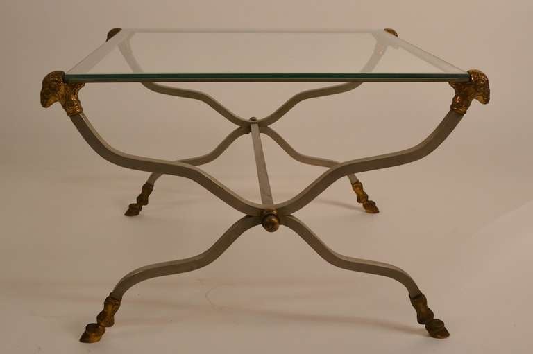 Steel and Brass Neo Classical, glass top tables. Rams heads, squared steel 