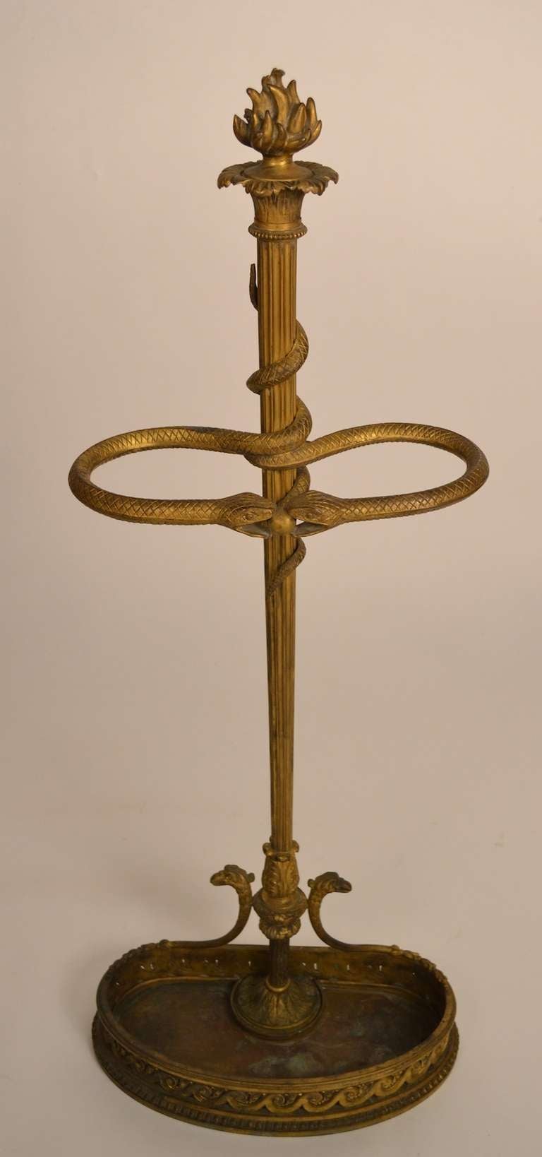 Solid Brass, probably French, 19th C Flame top, with fluted column which has a Snake wrapped around, and Griffen  head supports on the base. Fine quality crisp castings, amd fine detailed craftsmanship.