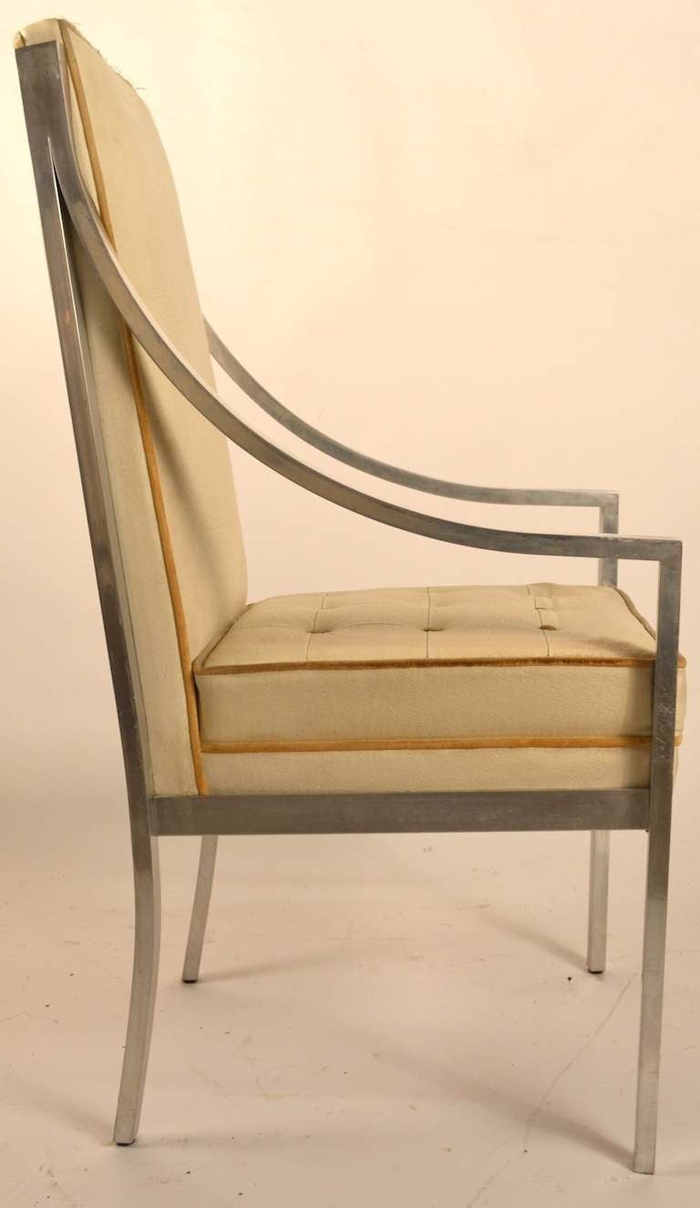 Two Arm, and four Side chairs, polished square aluminum frames upholstered seats and backs ( will need to be reupholstered ) 
Dimensions in listing are for the arm chairs, contact us for complete and additional dimensions.