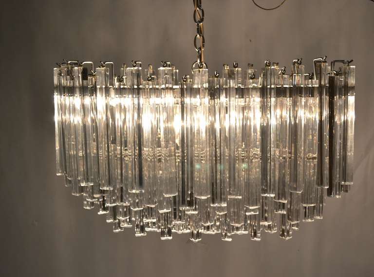 Large Oval crystal drop chandelier by Venini. impressive scale and excellent original condition. Brilliant triangular prims hang from chrome frame, original chain and canopy included/