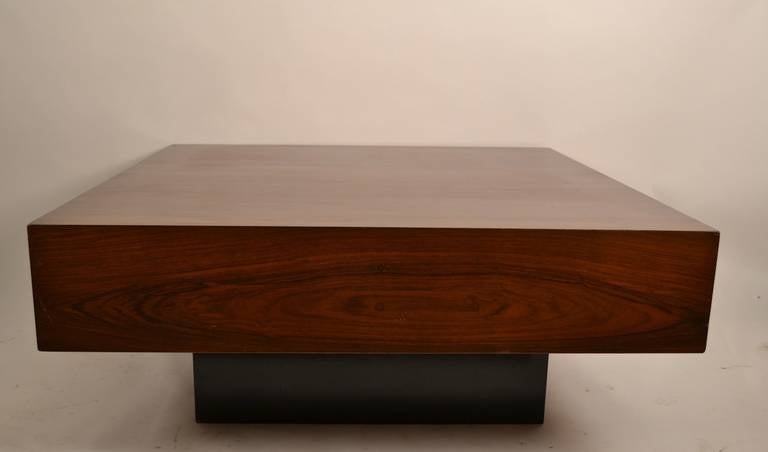 Classic Danish Dyrlund cube coffee table. Rosewood top rests on black plinth base creating a 