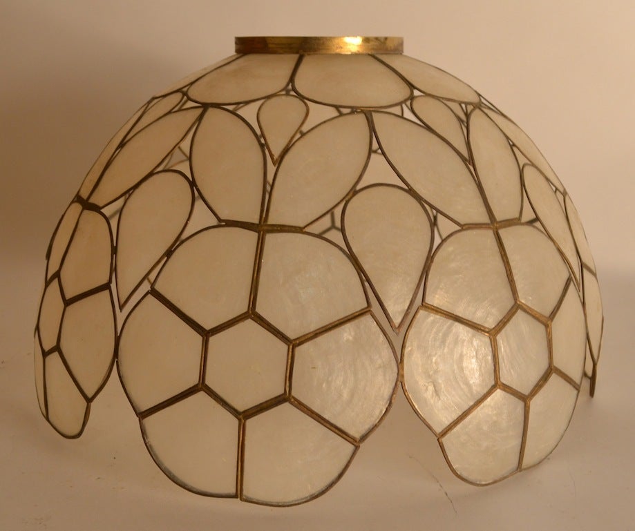 Pair of Capiz shell lamp shades, suitable for table or floor lamps, or can be wired to use as hanging lights as well. One shade has very minor scratch, as shown, overall excellent ready to use condition. Standard size hardware will fit most harps,