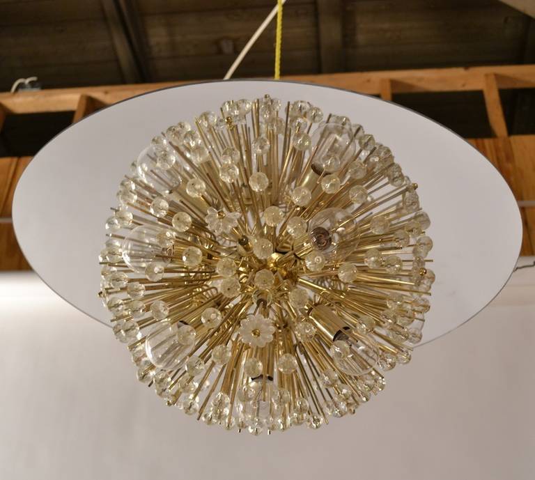 Half ball Starburst hangs beneath a mirrored mylar disk, to create the illusion of a full round ball fixture. Interesting variation of the classic, and more common, ball Starburst chandelier form. One of the glass flowers is damaged ( see pictures