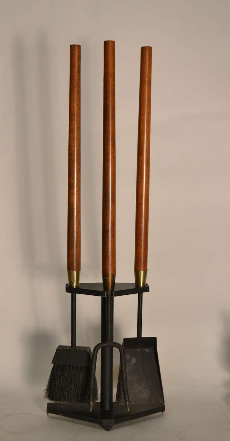 Long elegant walnut handles, brass collars, and solid iron tool - Iron and steel base. Set consists of a brush, fork, and shovel.