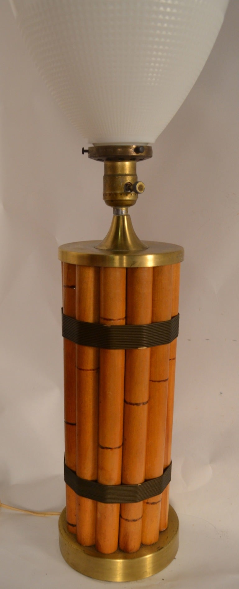 Bamboo wrapped with brass wire table lamp designed by Russel Wright. Height of base w/o glass shade 13.5