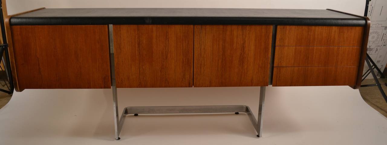 Classic chic cool modern style credenza server - Rosewood with chrome leg, and black top.