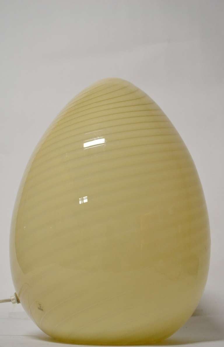 Large glass egg form lamps, swirl pattern technique. Hard to find matched pairs, in perfect condition. Marked with label 