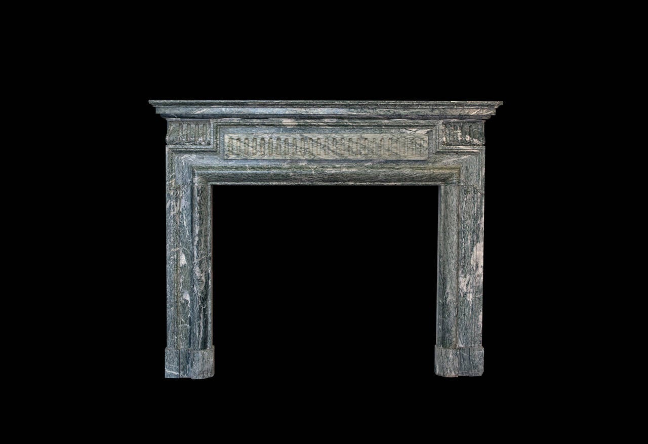 Bolection de Versailles mantel in the manner of Louis XIV in Campan green marble.

Opening dimensions: 41 1/4