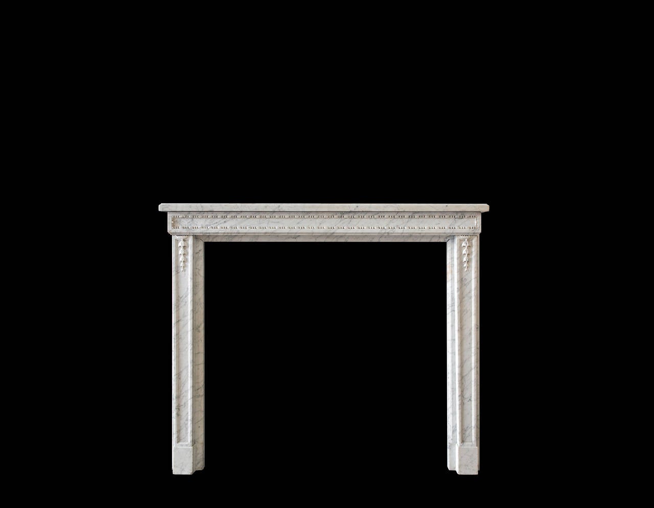 Petite French mantel in Carrara marble with beaded frieze. 

Opening dimensions: 38