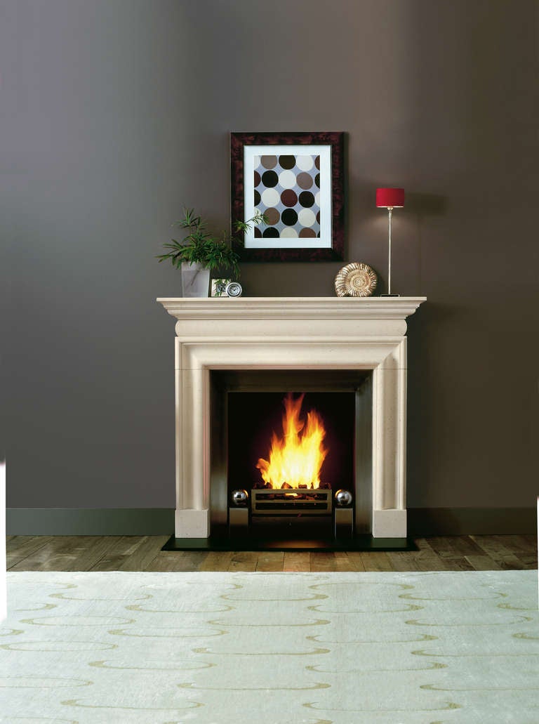 Limestone bolection mantel based on a Queen Anne design from the early 18th century.