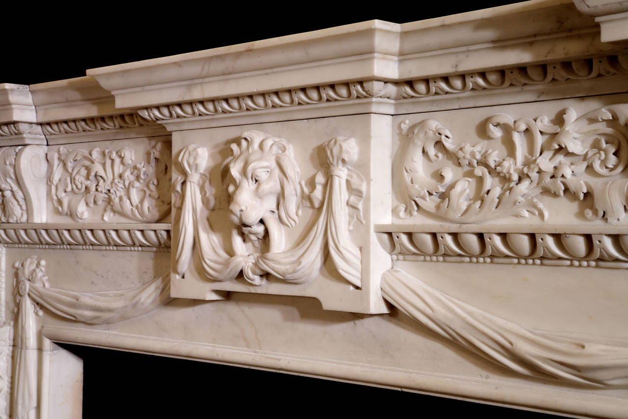 A very important George II statuary marble chimneypiece dating to the period 1750–1755 and representing an outstanding example of the growing influence of Rococo design on the strict formality of Palladianism. (GEO-ZD60).

Opening dimensions: 52