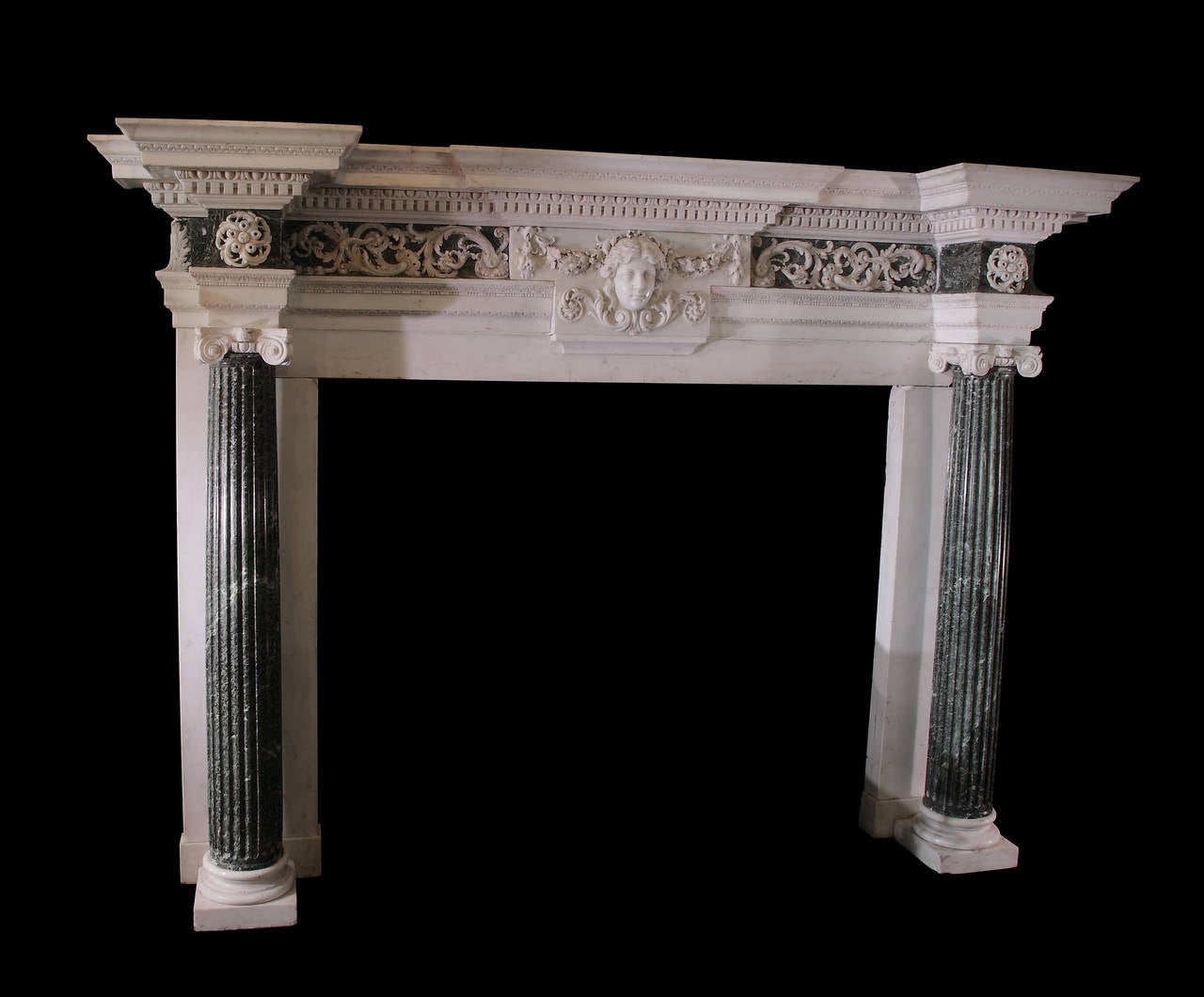 A George II Verde Antico and Statuary marble chimneypiece, circa 1750, the design attributed to Isaac Ware (d.1766) for James Stanhope, 4th Earl of Chesterfield’s town house, Chesterfield House, London, and possibly carved by the workshops of James
