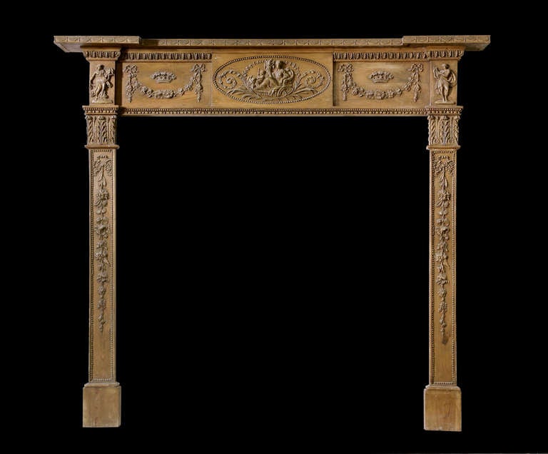 A good 18th century pine and Gesso Georgian mantel with heavy foliate motifs. Opening dimensions: 43