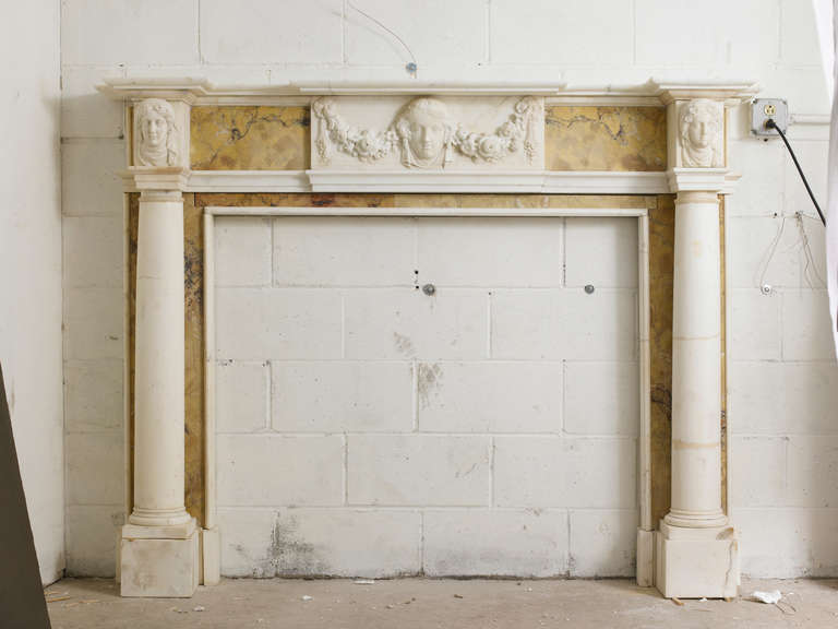 Georgian style statuary and sienna mantel with statuary center tablet and corner blockings. Opening dimensions: 48" W x 40" H.