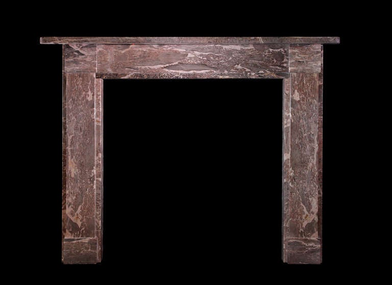 A Regency period chimneypiece of simple form in attractively figured English Petit-tor marble with plain jambs, frieze and corner blockings. Removed from Sowden lodge, Lympstone, Devon.
Opening dimensions: 38