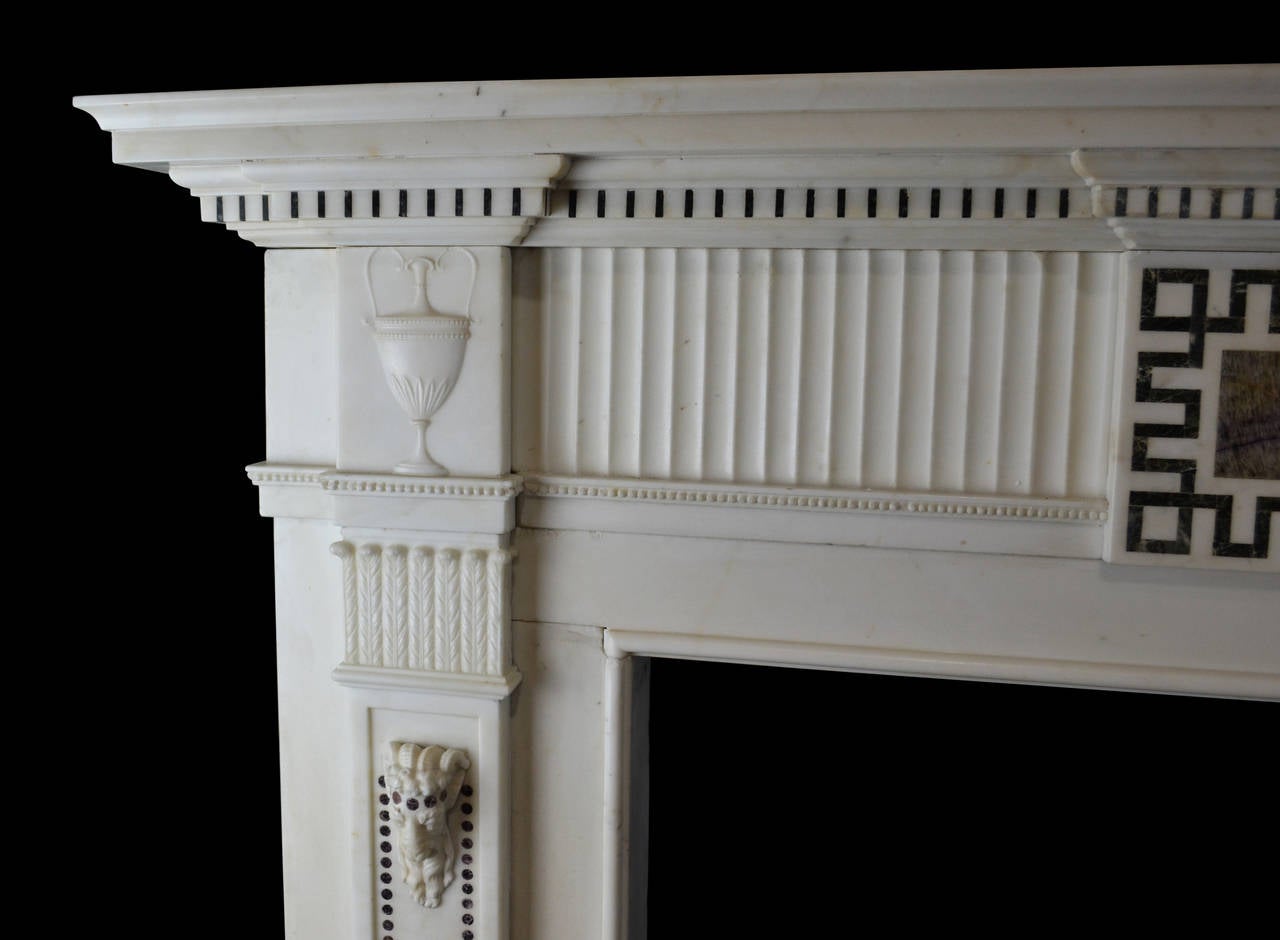 A very elegant and unusual late 18th century English mantel in Italian statuary marble inlaid with Derbyshire Blue John, a semi-precious stone mined at Castleton in Derbyshire and used in the manufacture of decorative items during the 18th and 19th