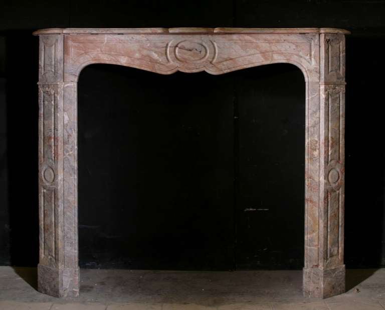 Rouge Royale marble 19th century Louis XV Pompadour style mantle. Opening Dimensions: 34.25
