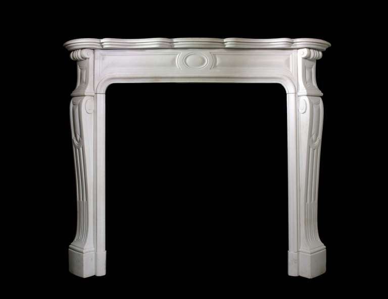 A Statuary marble 19th c Louis XV pompadour style mantel. Opening Dimensions: 36.75