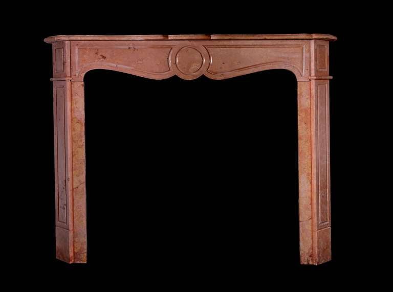 19th century Louis XV Pompadour style mantel in Rosa Verona marble. Opening dimensions: 39