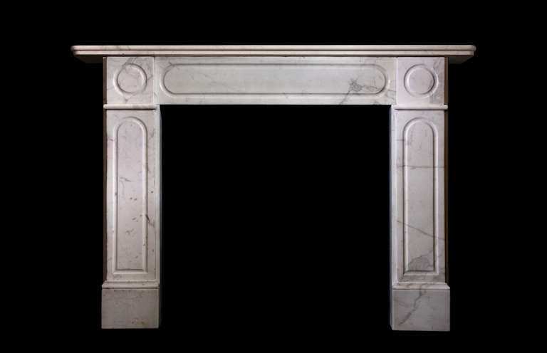 An early Victorian mantel in statuary marble. Opening dimensions: 36.5