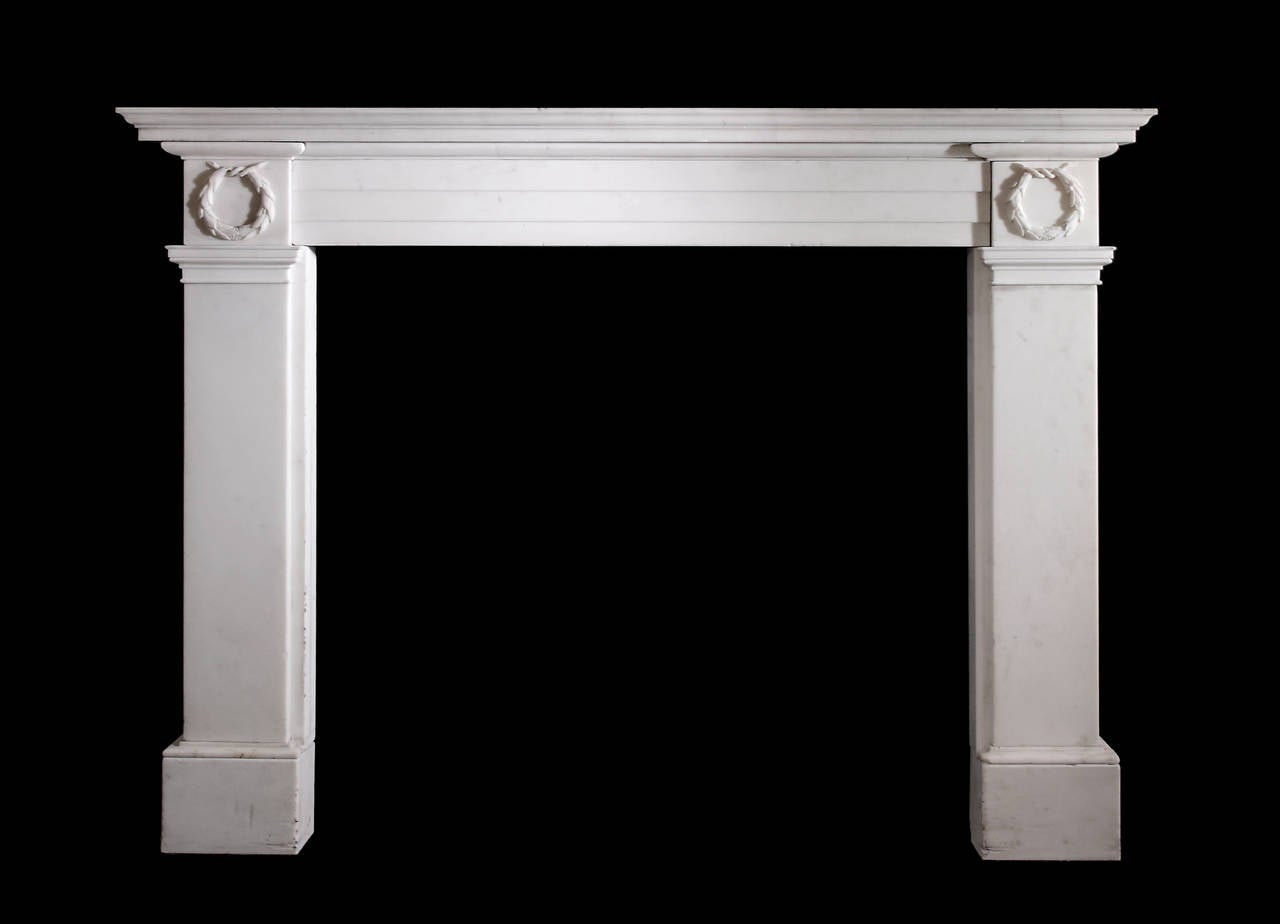 Early 19th c. statuary mantel with garlands to the corner blocks and stepped frieze c.1830
Opening dimension 43