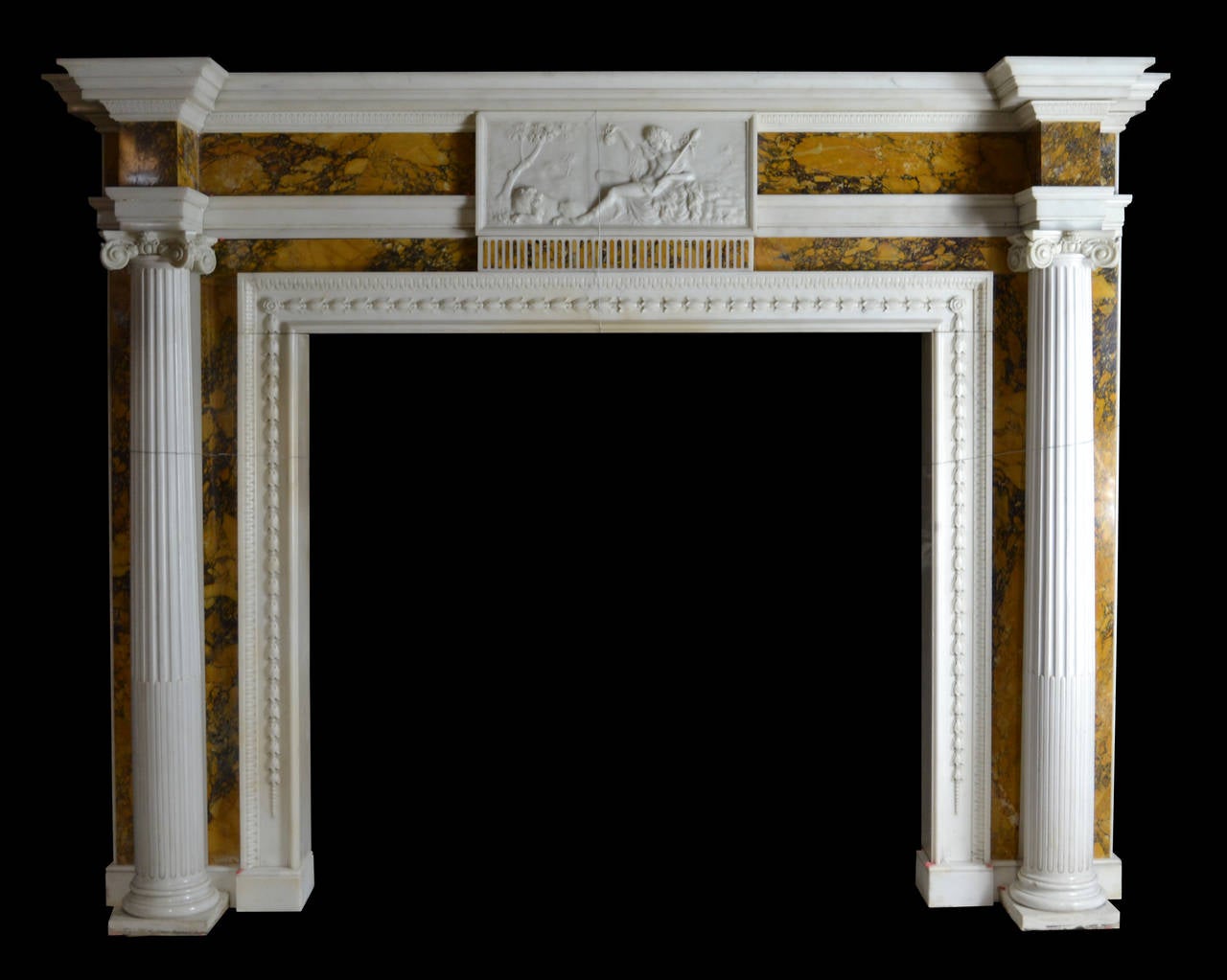 An imposing late 18th century Irish chimneypiece in Italian statuary with richly colored and strongly veined Convent Siena marble inlay, circa 1790.

Opening dimension: 53 1/4