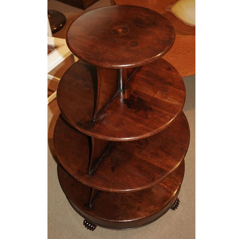 English Regency mahogany What Not / Book table, circular form with paw feet. Early 19th century.