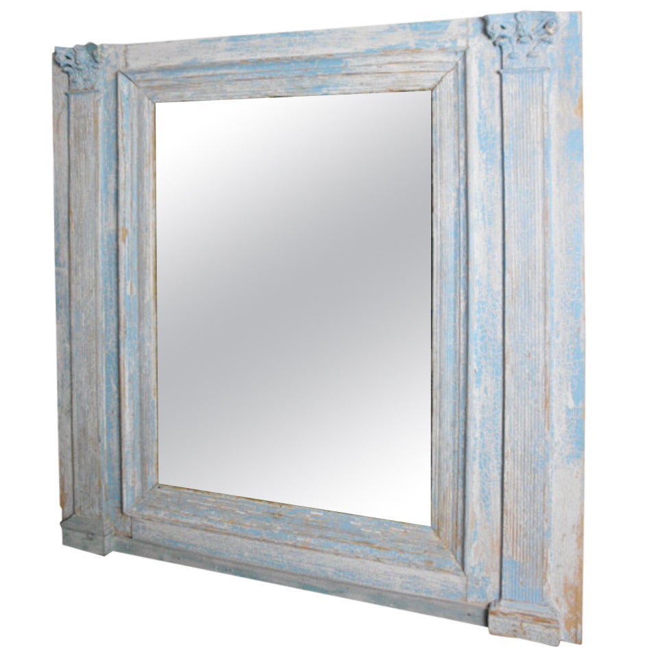 A large 19th century French mirror de Boisiere in original blue paint.  The mirror plate has been replaced with distressed foxed mirror plate.