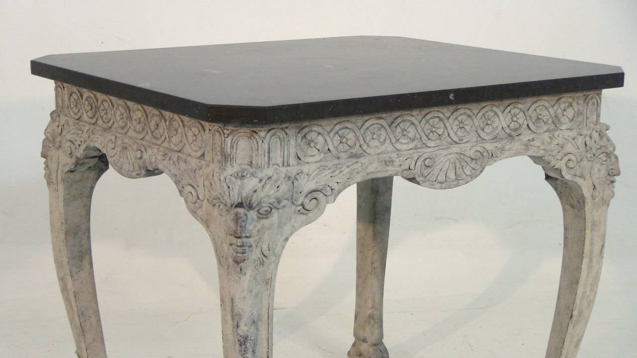 An extraordinary, richly carved Swedish table with original marble top with fossils from Gotland, Sweden.