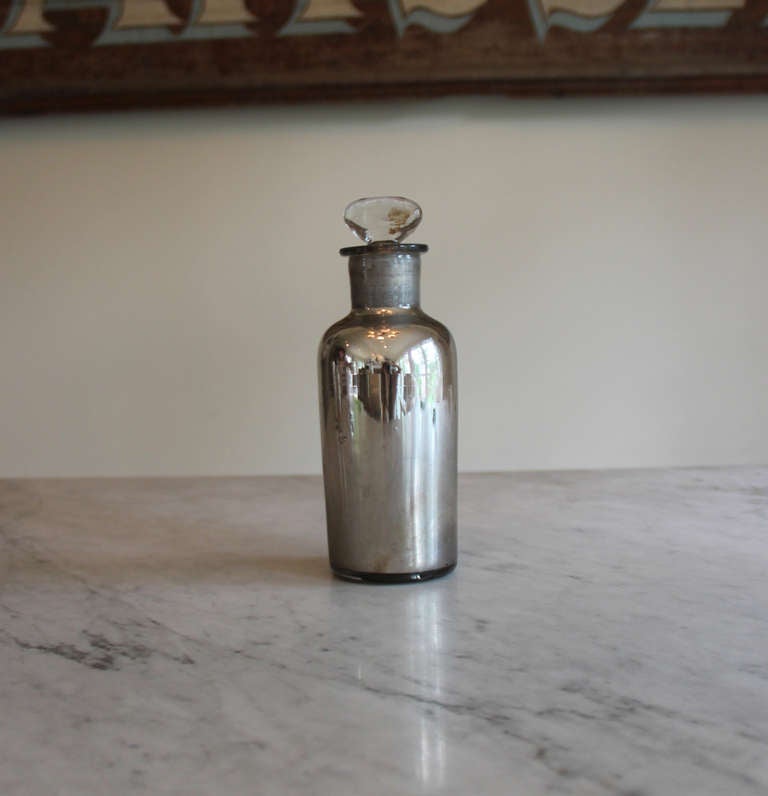 Please ask about group pricing.

Extremely rare 19th century French mercury glass apothecary bottle with glass stopper.  This is perhaps the most exciting purchase we've made in Provence. Authentic antique mercury glass is becoming more difficult