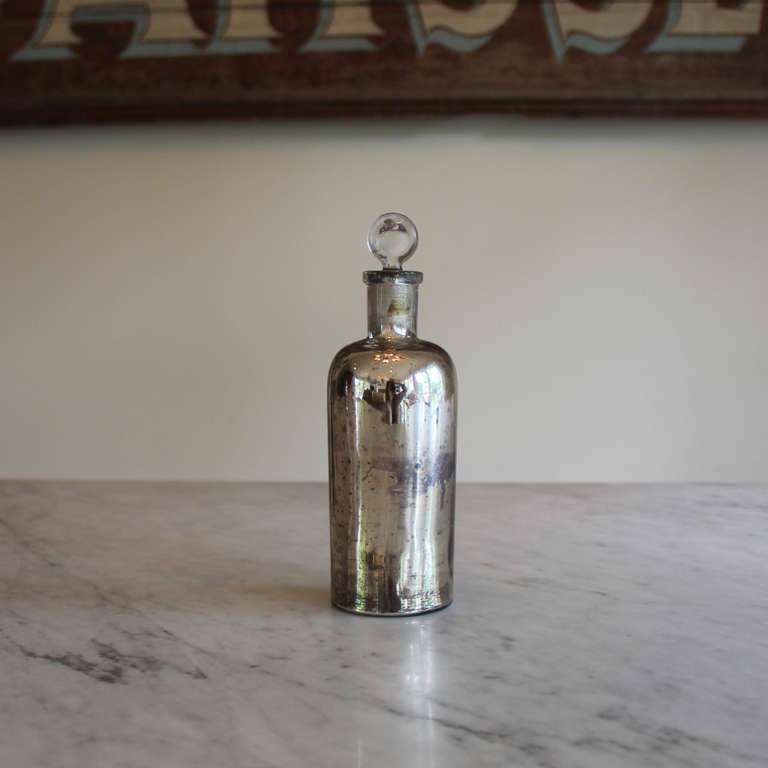 Please ask about group pricing.

Extremely rare 19th century French mercury glass apothecary bottle with glass stopper.  This is perhaps the most exciting purchase we've made in Provence. Authentic antique mercury glass is becoming more difficult