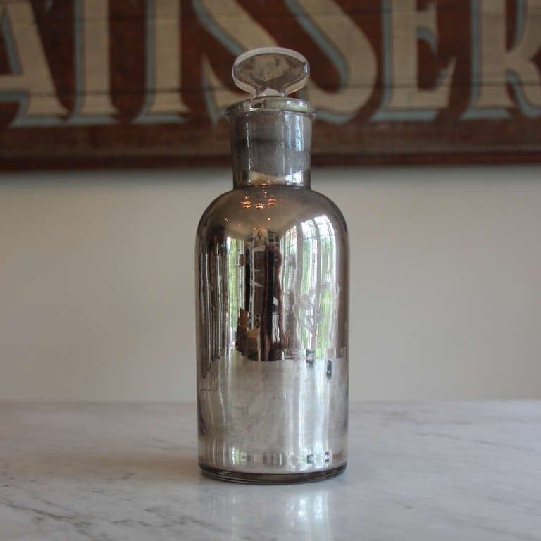 Please ask about group pricing.

Extremely rare 19th century French mercury glass apothecary bottle with glass stopper.  This is perhaps the most exciting purchase we've made in Provence. Authentic antique mercury glass is becoming more difficult