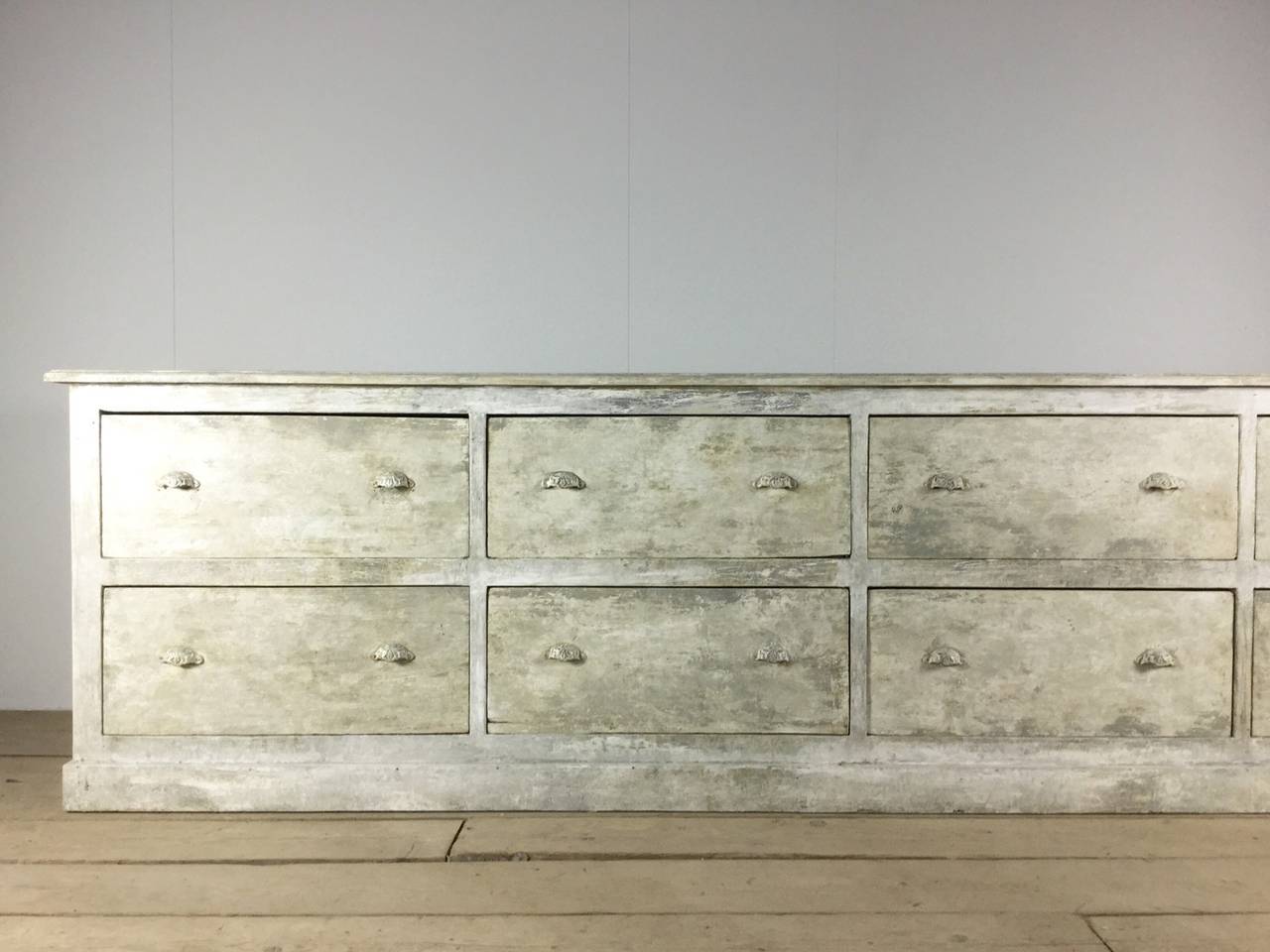 A stunning, grand-scale French sideboard with eight large drawers and original decorative D cup hardware.