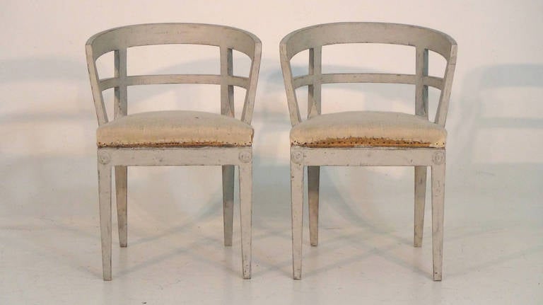 A pair of 19th century Swedish sulla chairs with original upholstery.  We absolutely love this unique and funky pair!