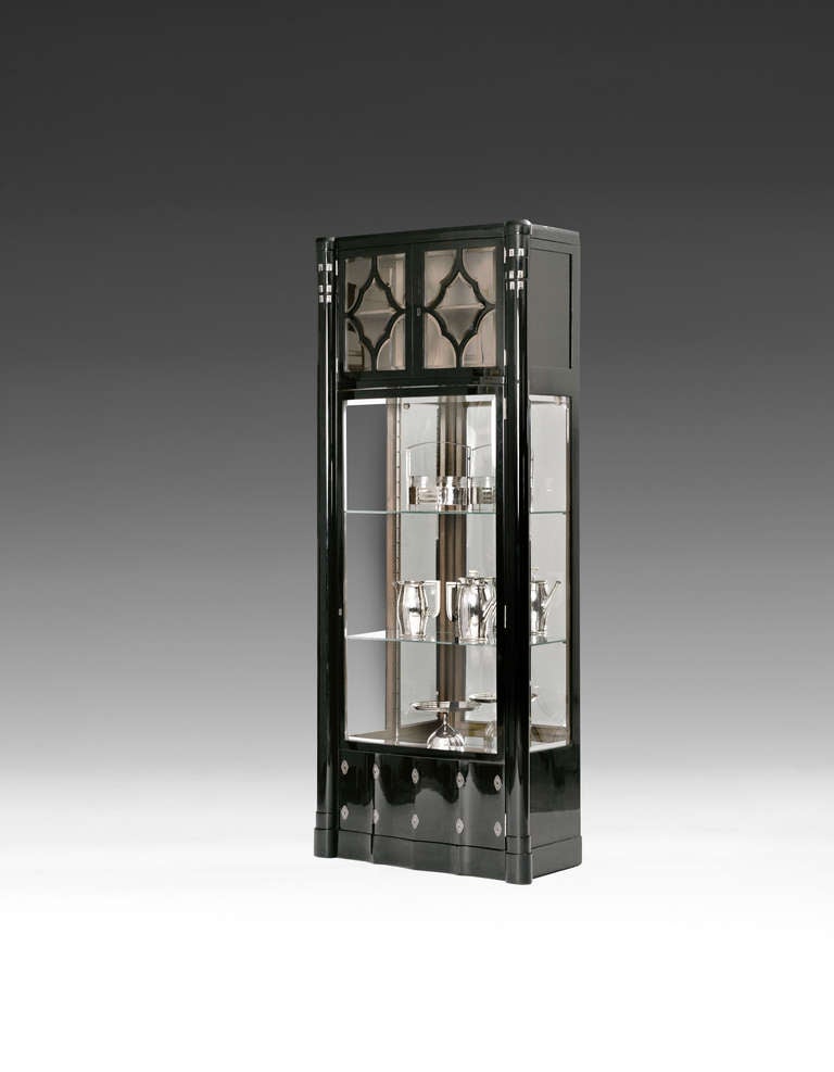 JUGENDSTIL SHOWCASE

Designed: Vienna or Budapest, around 1910.
Executed: cabinetmaker at present unknown, Vienna or Budapest.

Solid pear and veneer, ebonized and polished, cut and facetted glass, geometric inlay in mother of pearl and brass,