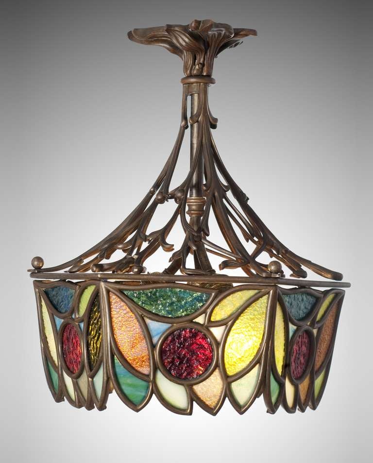 CHANDELIER

designed and executed: Vienna, around 1900

cast bronze, multi-coloured elements of glass, fitted in brass, three bulbs, first-class Viennese craftsmanship

very good original condition

H 42 cm, Ø 32 cm