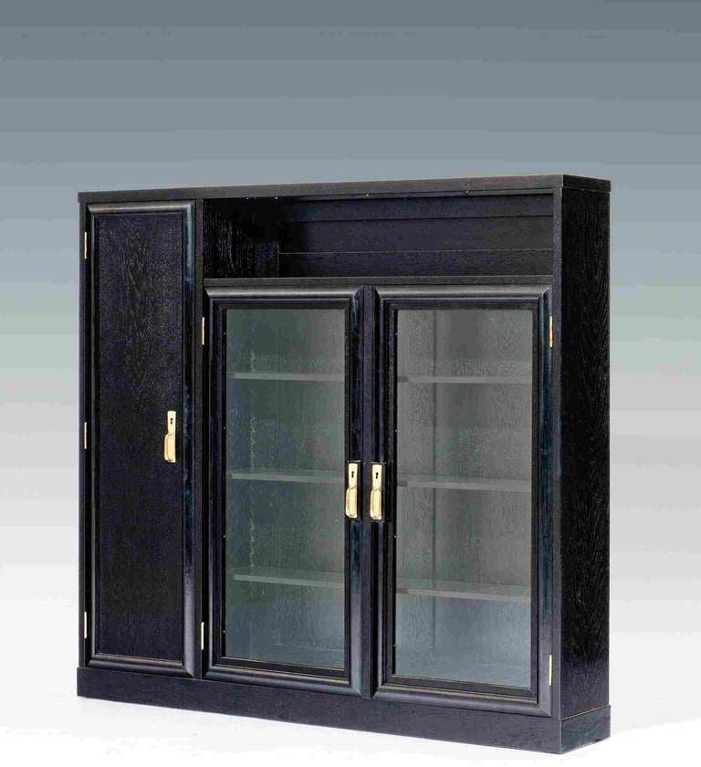SCHOOL OF PROF. JOSEF HOFFMANN

designed and executed: Vienna, around 1910

solid oak and veneer, stained black, brass fittings polished and stove enamelled, surface professionally repolished, high-quality Viennese cabinet making

H 131.5 cm,