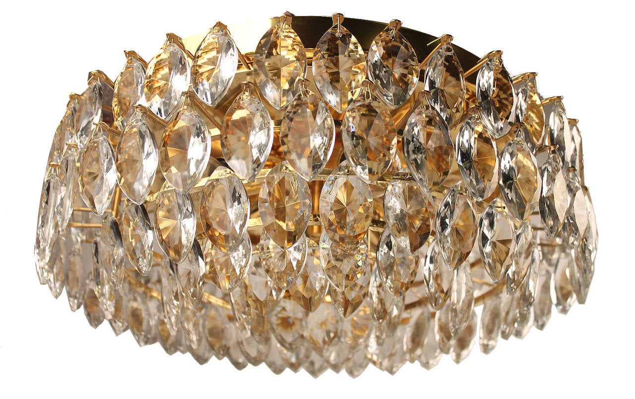 Flush mount light by Lobmeyr, Vienna with diamond Marquise pattern cut glasses on a 5 Tier structure, high end qualtiy

Six candelabra size bulbs.

With the 1960s came the accentuated use of glass elements and vintage Italian lights