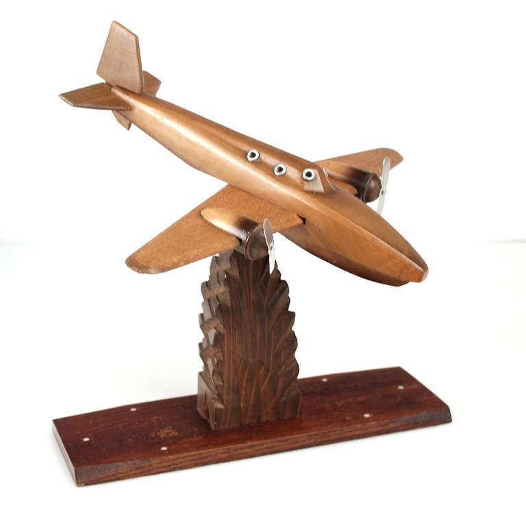 Great, 1930s handmade airplane model crafted from wood with applied metal accents. Great desk accessory.

The Art Deco style name was derived from the Exposition Internationale des Arts De´coratifs ET Industriels Modernes, held in Paris in 1925,